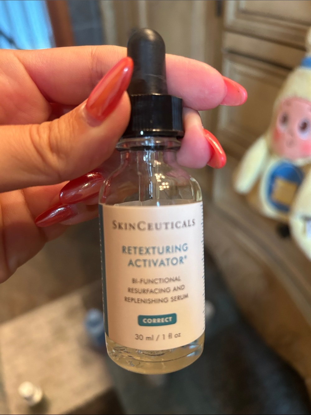 SkinCeuticals Retexturing Activator Serum - black dropper, cream label